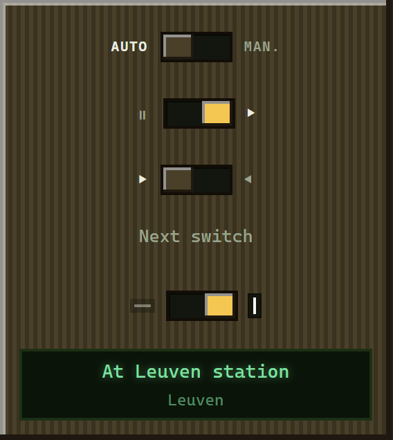 The driving console: an auto/manual switch, a throttle, a direction lever, a horn, and a status display reading Departing from Leuven.